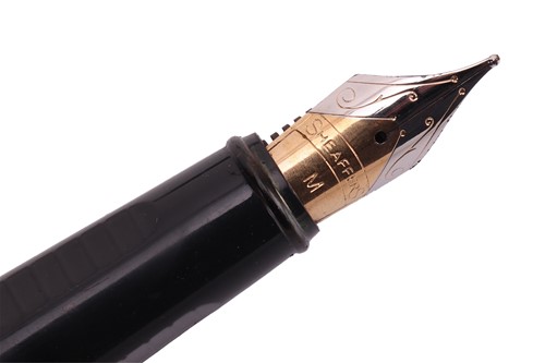 Lot 86 - A Cartier Love ballpoint pen in burgundy...