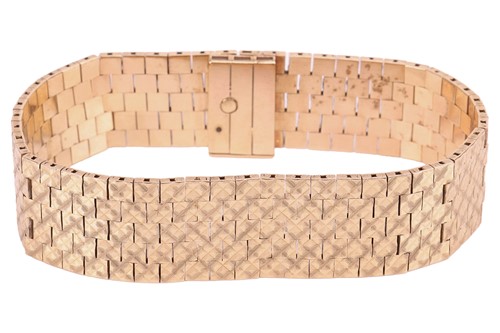Lot 224 - A brick link bracelet in 9ct yellow gold,...