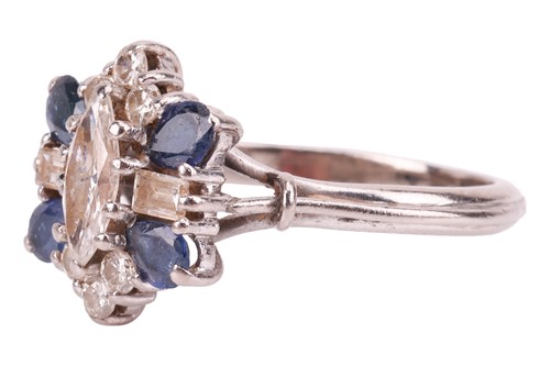 Lot 8 - A diamond and sapphire cluster ring, with an...