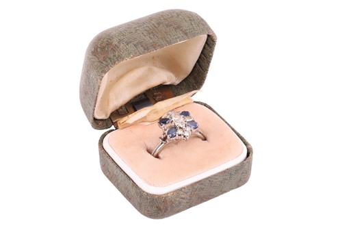 Lot 8 - A diamond and sapphire cluster ring, with an...