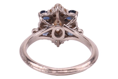 Lot 8 - A diamond and sapphire cluster ring, with an...
