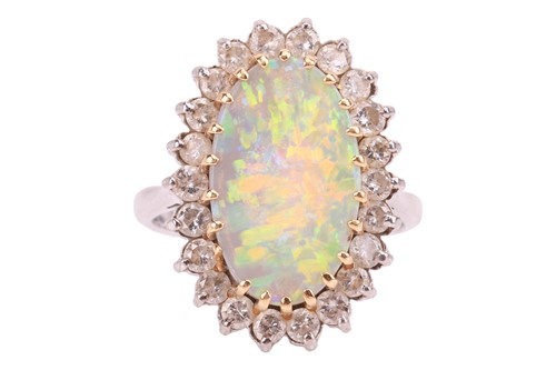 Lot 223 - An opal and diamond cluster ring, featuring a...