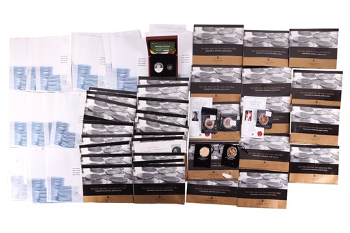 Lot 102 - A large group of commemorative coin sets, to...