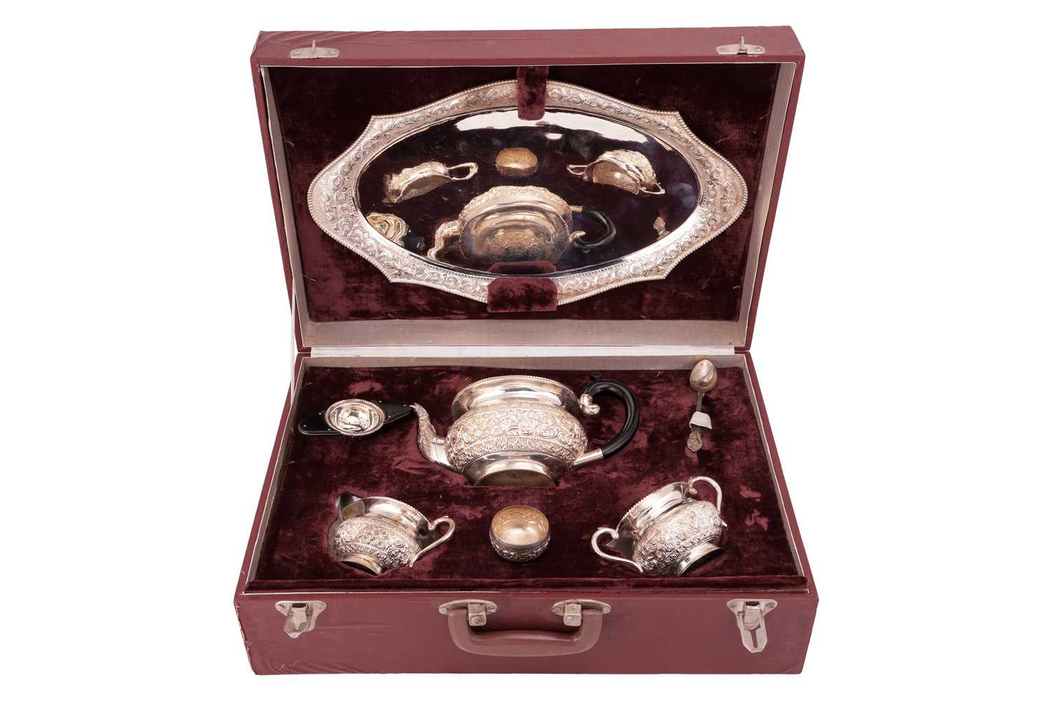 Lot 125 - An Indian five-piece tea set, in fitted case,...