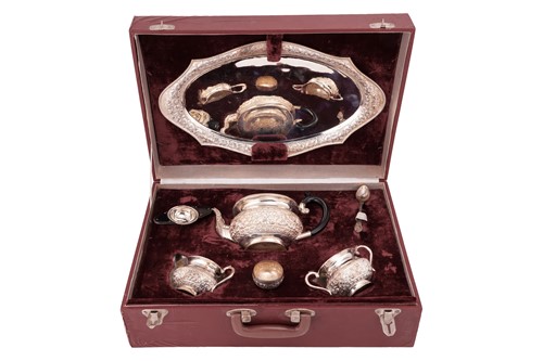 Lot 125 - An Indian five-piece tea set, in fitted case,...