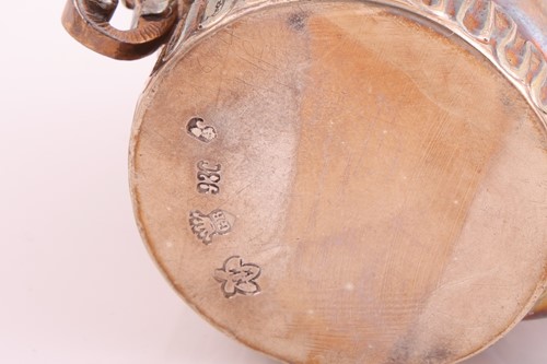 Lot 92 - An Arts and Crafts silver three-handled bowl,...