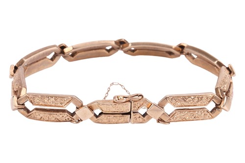 Lot 39 - A fancy link bracelet, testing as 10ct,...
