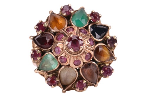 Lot 216 - A Thai 'Noppakao' princess ring, tiered ring...
