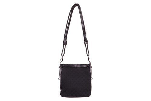 Lot 139 - Gucci - a crossbody bag in black monogrammed...