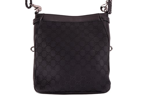 Lot 139 - Gucci - a crossbody bag in black monogrammed...