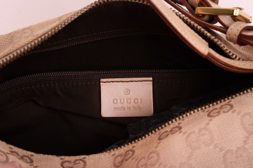 Lot 135 - Gucci - a shoulder bag in beige canvas with...