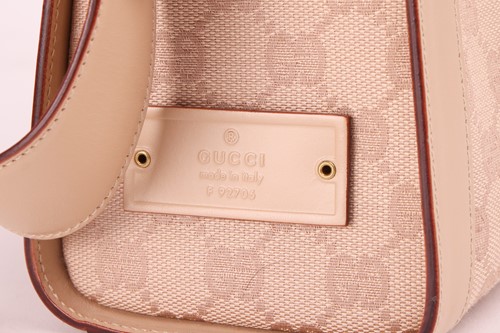 Lot 135 - Gucci - a shoulder bag in beige canvas with...