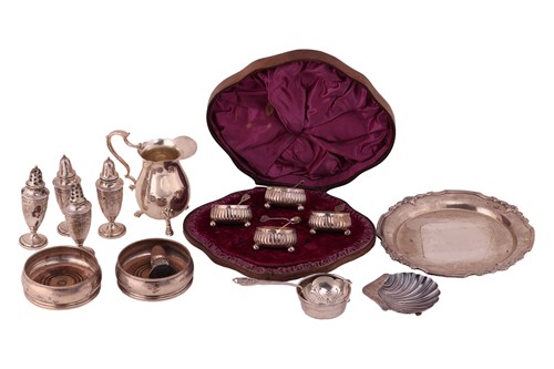Lot 99 - A cased set of four Victorian silver salts,...