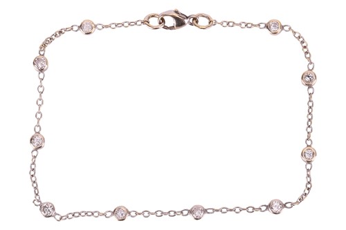 Lot 78 - A diamond-set bracelet, featuring ten round...