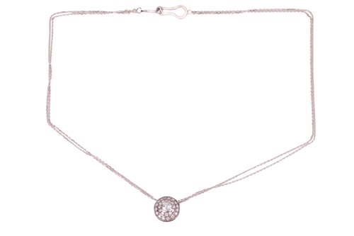 Lot 70 - A diamond target pendant and chain; featuring...