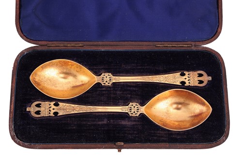 Lot 108 - A cased set of silver gilt spoons and sugar...