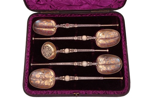 Lot 108 - A cased set of silver gilt spoons and sugar...