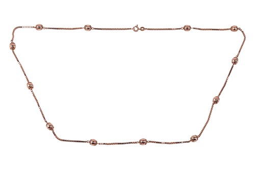 Lot 131 - A bead necklace in 9ct yellow gold, featuring...