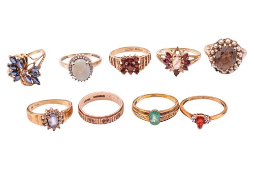 Lot 72 - A collection of nine gem-set rings in 9ct gold;...