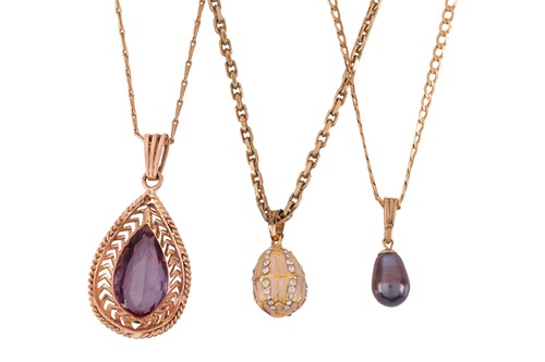 Lot 67 - Three pendant on chains; including a synthetic...