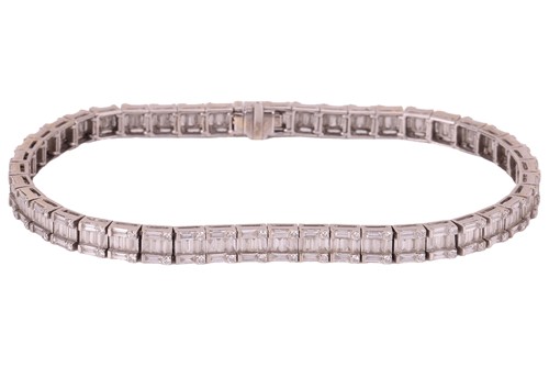 Lot 49 - A diamond line bracelet; comprising forty-five...