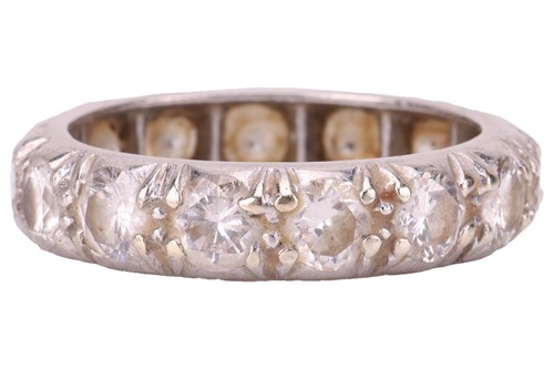 Lot 58 - A diamond-set eternity ring, comprising...