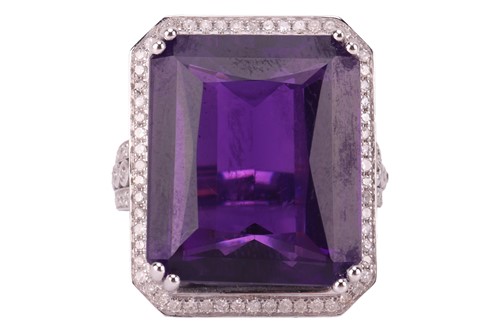Lot 122 - An amethyst and diamond dress ring, comprising...