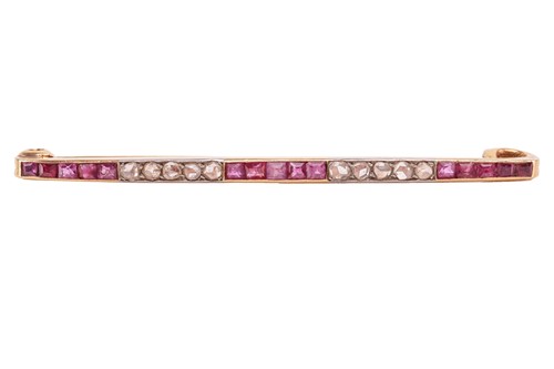 Lot 59 - A ruby and diamond bar brooch, comprising...