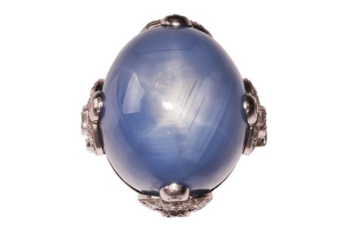 Lot 235 - A star sapphire cabochon and diamond cocktail...