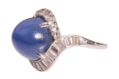 Lot 94 - A star sapphire and diamond cluster ring,...