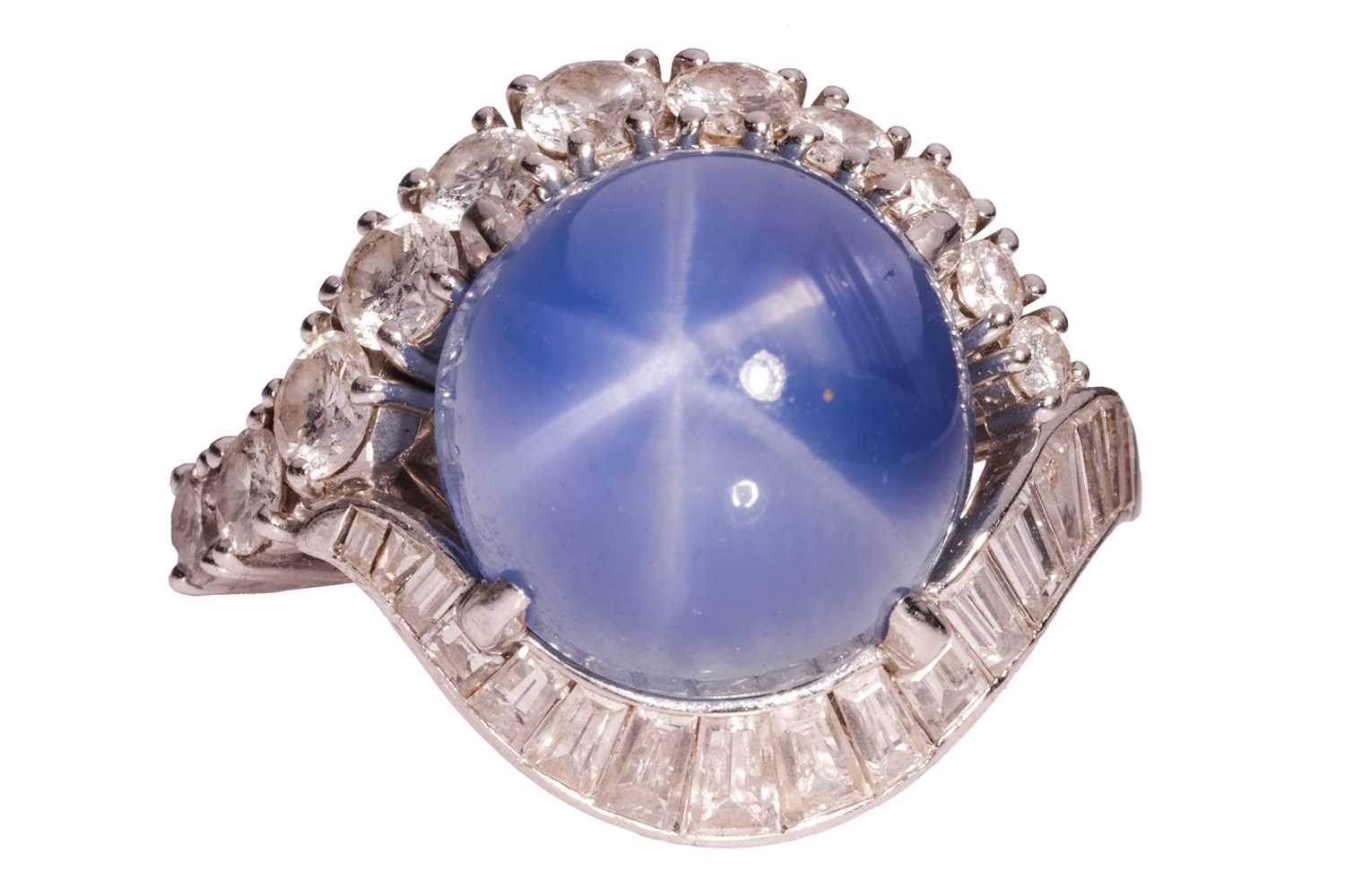 Lot 94 - A star sapphire and diamond cluster ring,...