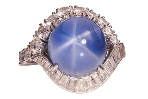 Lot 94 - A star sapphire and diamond cluster ring,...