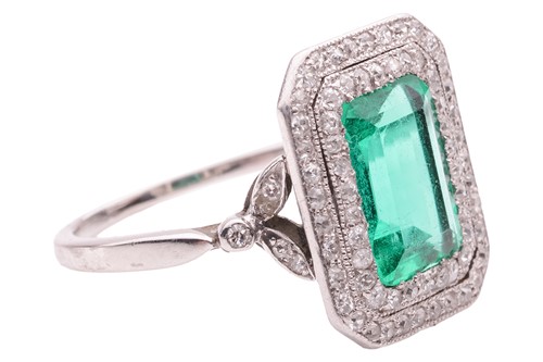 Lot 233 - An emerald and diamond-set cluster ring, the...