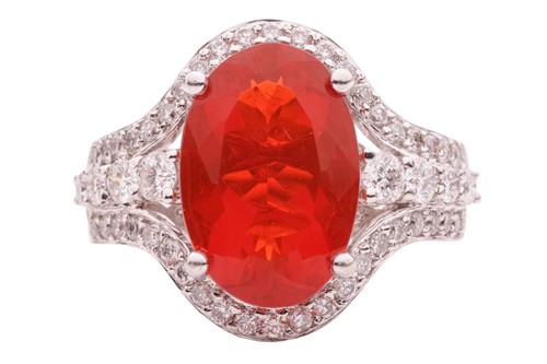 Lot 36 - A fire opal and diamond-set cluster ring, the...