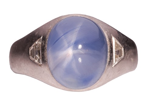 Lot 230 - A star sapphire and diamond gypsy ring,...