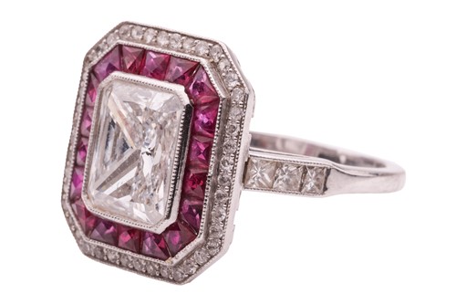 Lot 232 - An Art Deco diamond and ruby cluster ring,...