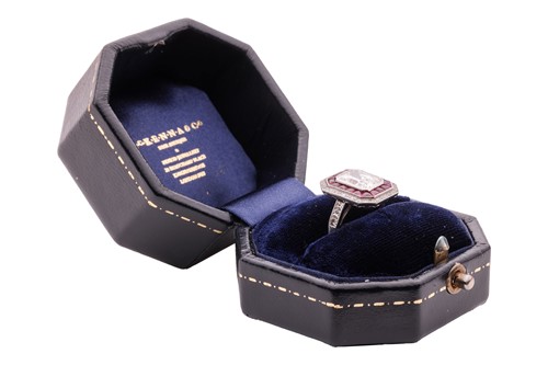 Lot 232 - An Art Deco diamond and ruby cluster ring,...