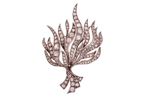 Lot 203 - A diamond-set brooch of stylised foliate...