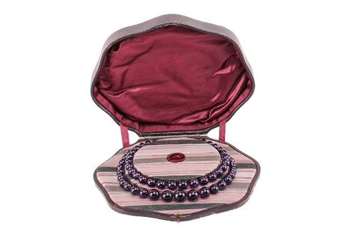 Lot 118 - A double-row amethyst bead choker necklace...
