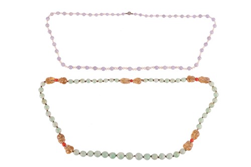 Lot 135 - Two graduated jade bead necklaces; one...
