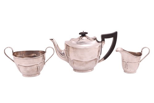 Lot 347 - An early 20th-century silver three-piece tea...