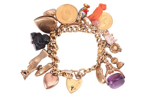 Lot 105 - A charm bracelet, comprising an 18ct yellow...