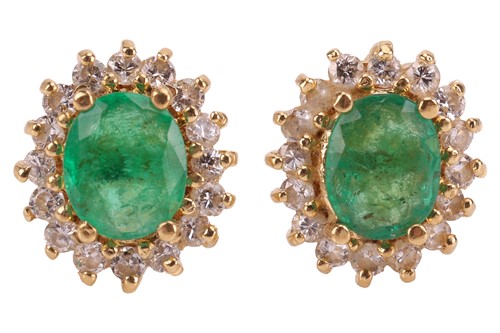 Lot 69 - A pair of emerald and diamond cluster stud...