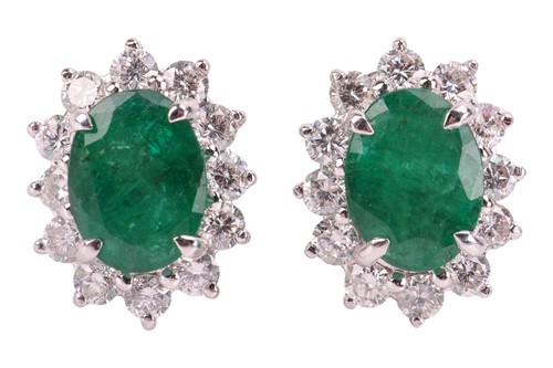 Lot 30 - A pair of emerald and diamond cluster stud...
