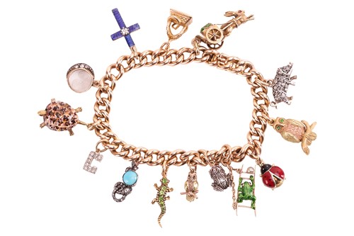 Lot 83 - A gem-set charm bracelet, comprising a curb...