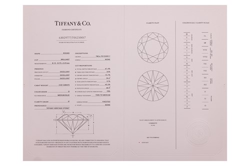 Lot 218 - Tiffany & Co. - a diamond solitaire ring in...