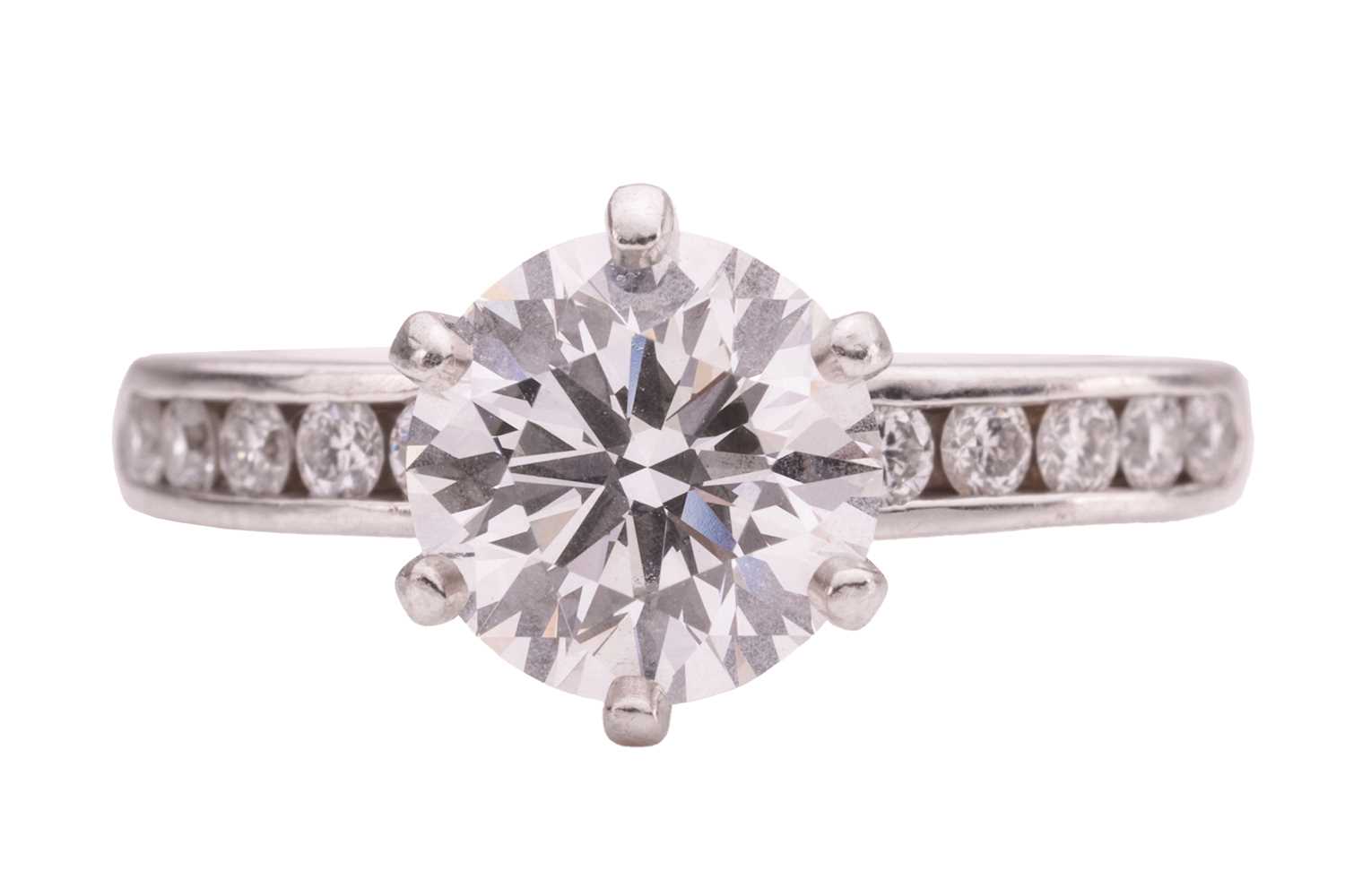 Lot 218 - Tiffany & Co. - a diamond solitaire ring in...