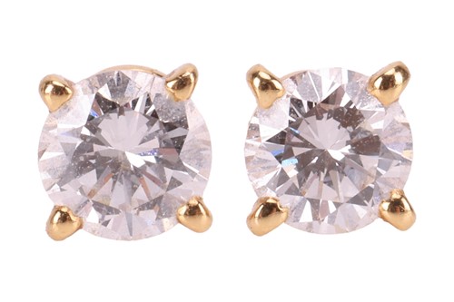 Lot 51 - Cartier - a pair of diamond stud earrings in...