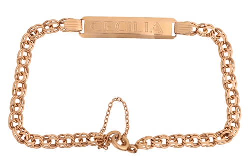Lot 47 - An engraved ID bracelet, the bevelled...