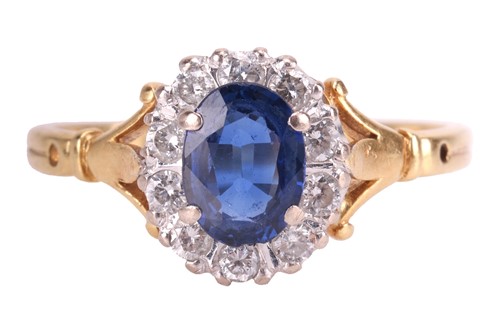 Lot 109 - An 18ct gold sapphire and diamond cluster ring,...